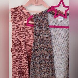 2 sleeveless vests / cover ups